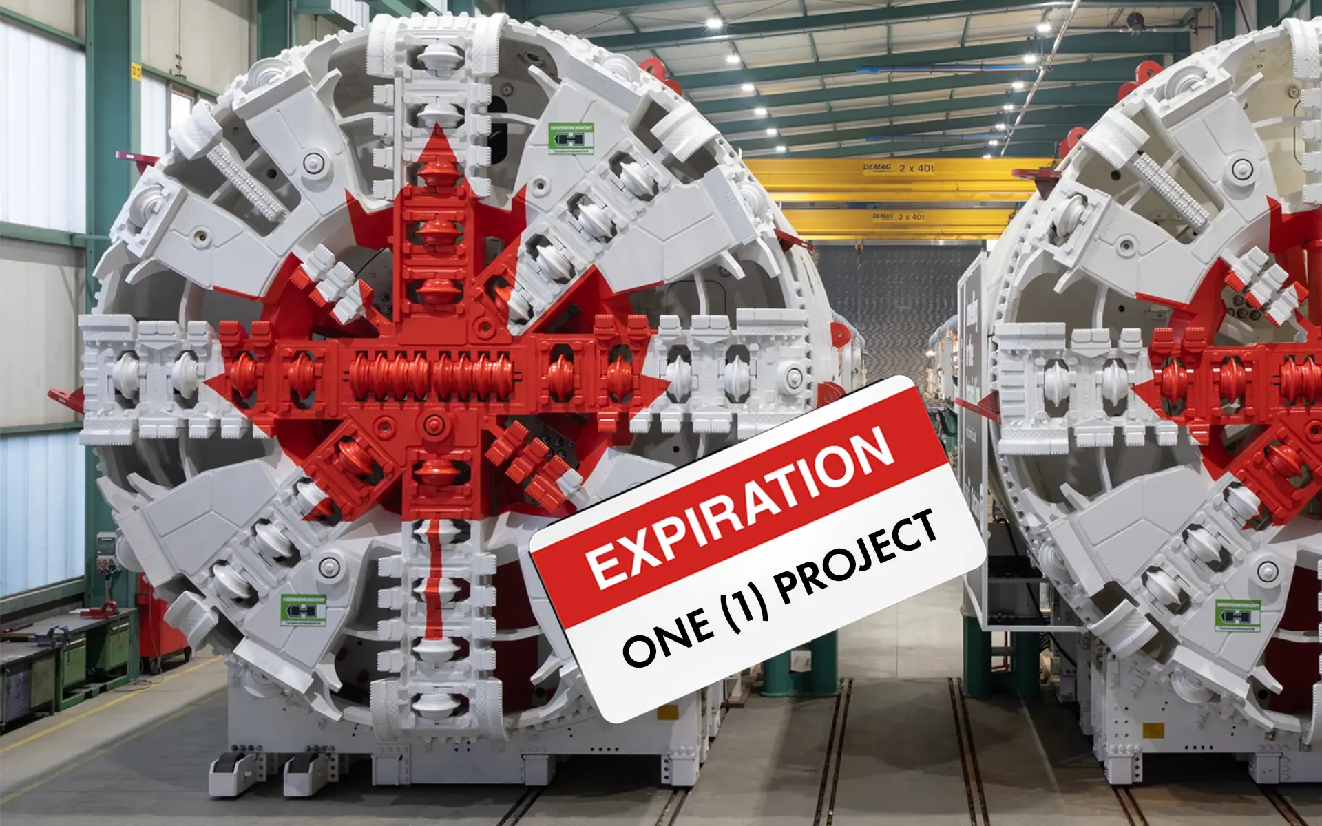 A tunnel boring machine painted white and red with a maple leaf pattern, photographed in an assembly hall. A label reading “EXPIRATION — ONE (1) PROJECT” is superimposed, symbolizing how Canada often treats infrastructure and major equipment as single-use.