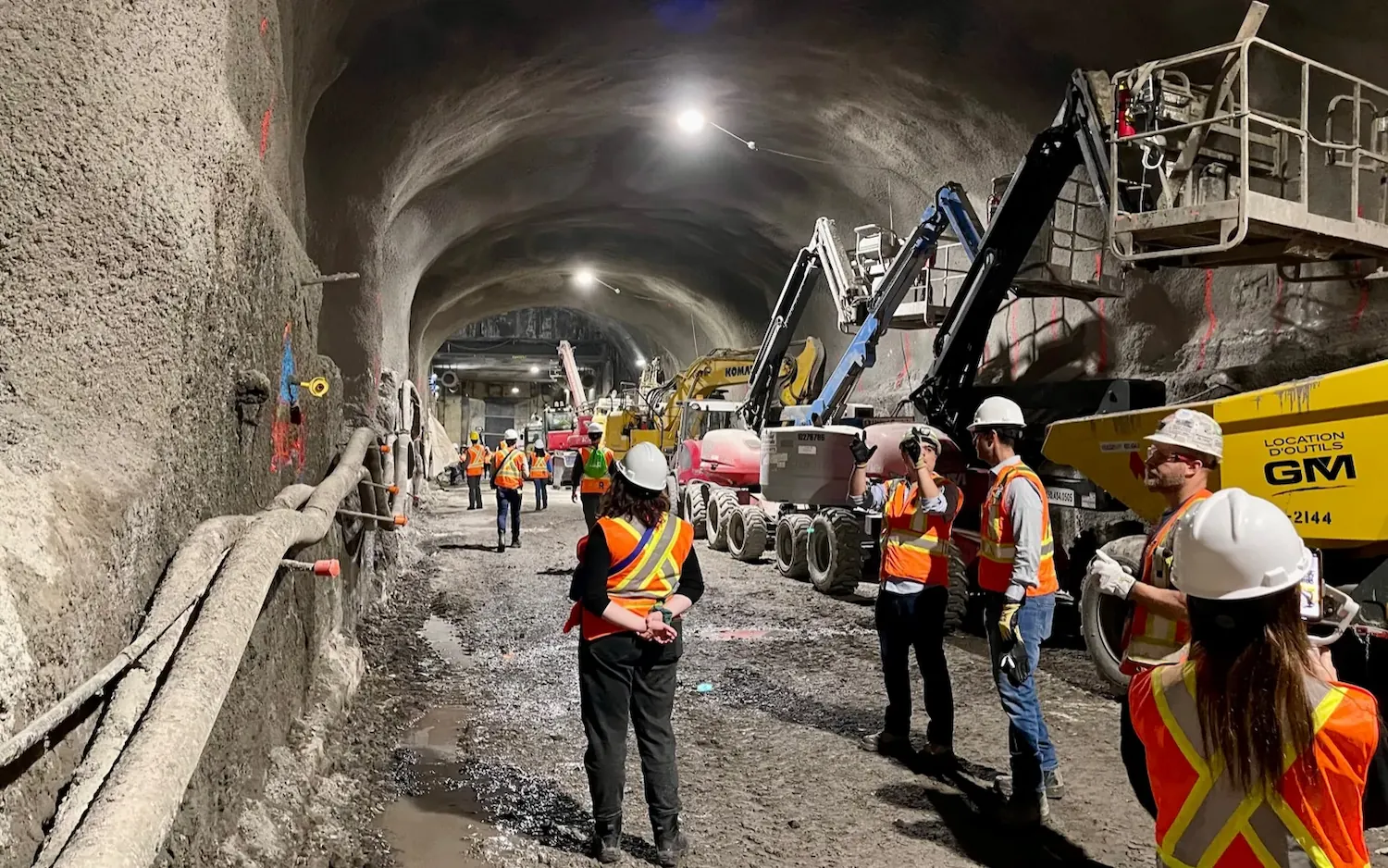 Construction crews working on the Montréal Réseau Express Métropolitain in the Mount Royal Tunnel between McGill and Gare Centrale.